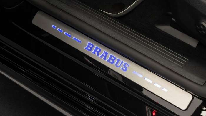 Image showing the optional illuminated Brabus kickplates for the Mercedes EQS.