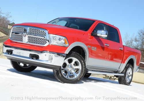 The 2013 Ram 1500 Laramie Crew Cab 4x4 in Flame Red with Silver trim