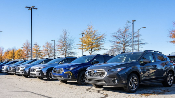 A row of 2024 Subaru Crosstrek models on dealer's lot
