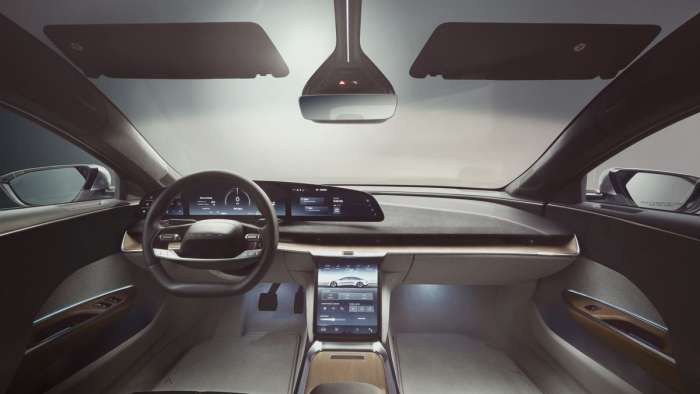 Interior shot of the Lucid Air showing the car's glass cockpit and pilot panel screen displays.