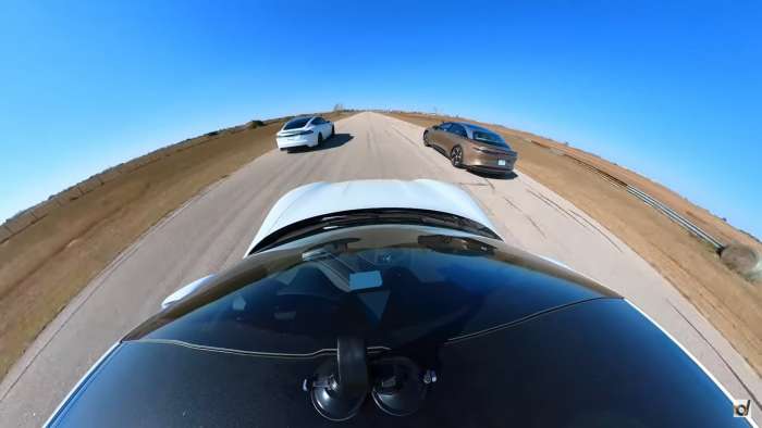 Image captured during the three-way drag race showing the Tesla Model S Plaid and Lucid Air Dream Edition leaving the Porsche Taycan Turbo S in their dust.