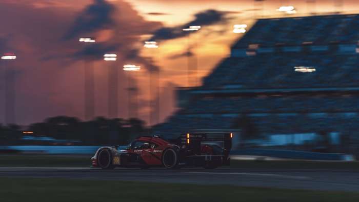 Image of the Porsche 963 during sunset testing at Daytona Speedway.