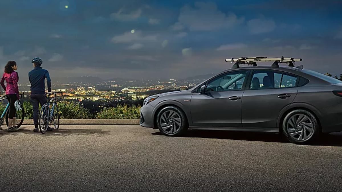 2024 Subaru Legacy with customers in a city overlook