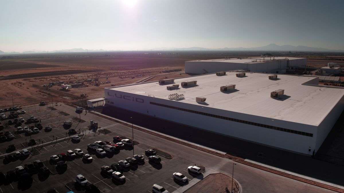 High-angle drone shot of Lucid's AMP-1factory in Casa Grande, Arizona. The factory's buildings feature hard edges and are mostly white to repel solar energy and keep them cool.