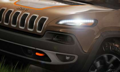 A teaser of the 2014 Jeep Cherokee headed to SEMA