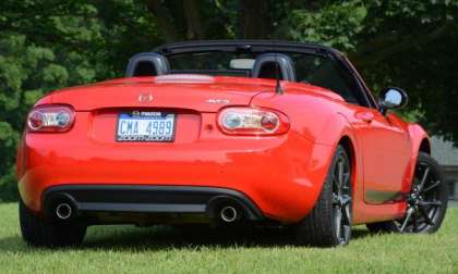The rear end of the 2013 Mazda MX-5 Club with the top down