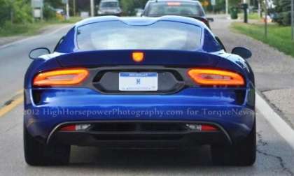 The 2013 SRT Viper GTS in bright metallic blue with the taillights lit