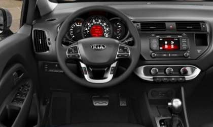 The dash and steering wheel of the 2012 Kia Rio SX 5-door