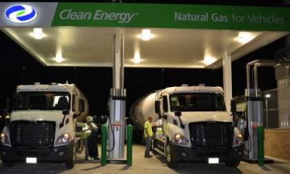 Two new Freightliner Cascadia day cabs at an NG filling station