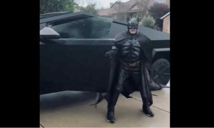 Cybertruck Owner Recreates Black Matte Wrapped "Batmobile" Cybertruck With Music And Costume To Boot