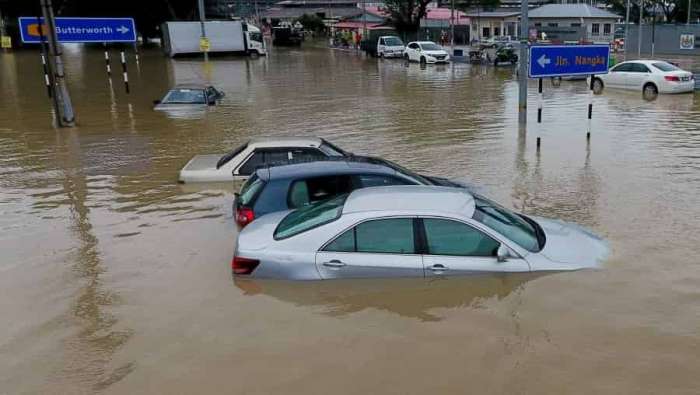 Vehicles Submerged After Torrential Rains