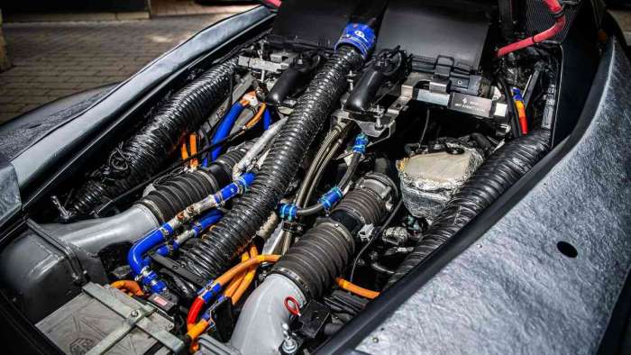 Image showing the engine bay of the LaFerrari prototype with a mess of wires and hoses visible.