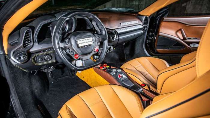 Image showing the interior of the LaFerrari prototype with luxurious tan leather seating and development notes taped to the steering wheel and dash.