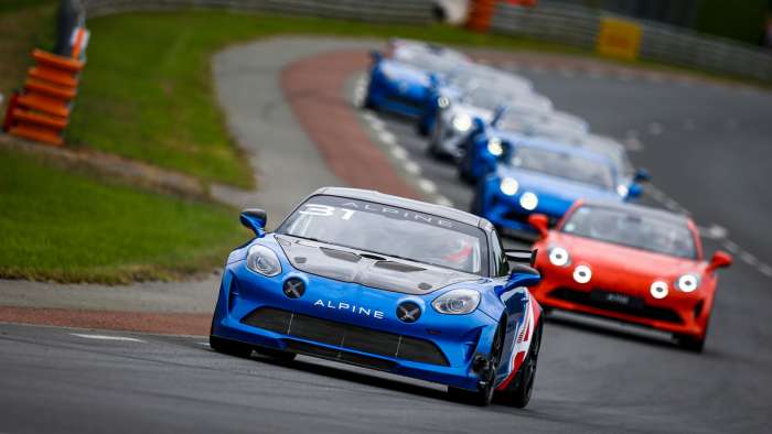 Image of an Alpine A110 GT4 racecar at the Nurburgring.