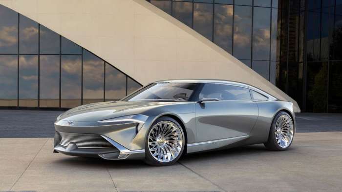 Image showing the low, sleek two-door Buick Wildcat EV Concept with large intricately designed wheels that look like BBS basket weave wheels crossed with aircraft turbines.