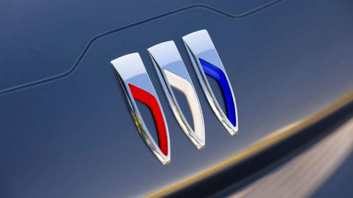Close-up view of the new Buick logo with its simplified design and three parallel shields.