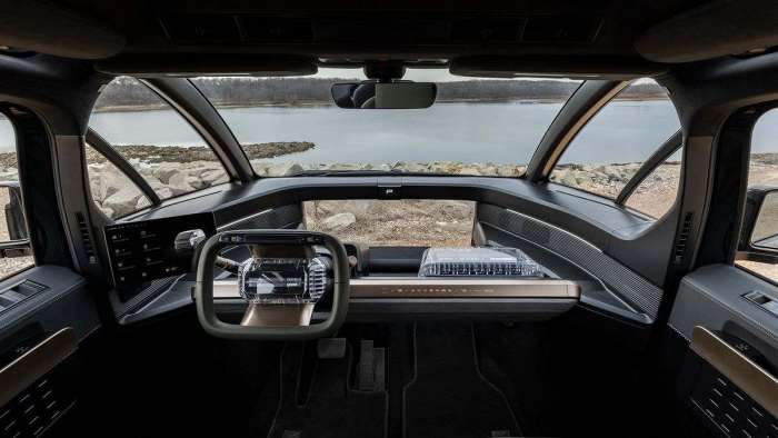 Interior view of the Canoo LV with its rectangular steering wheel.