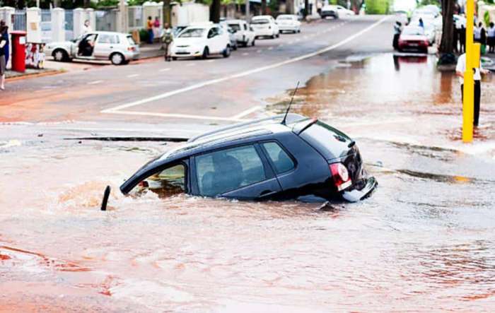 SUV Swimming In A Pothole