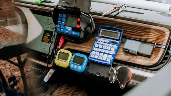 Interior of the R1T raced by Hall and Donaghe in the Rebelle Rally showing calculator and navigation equipment attached to the truck's dash.