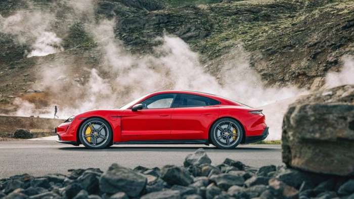 Side view of a red Porsche Taycan in Iceland