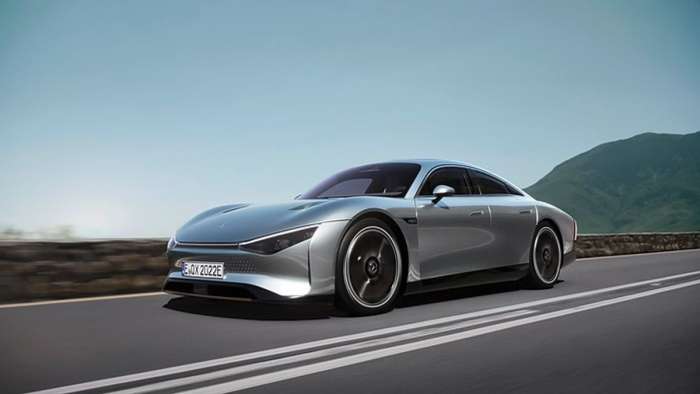 Low angle shot of the Mercedes-Benz EQXX concept car driving beside a lake.