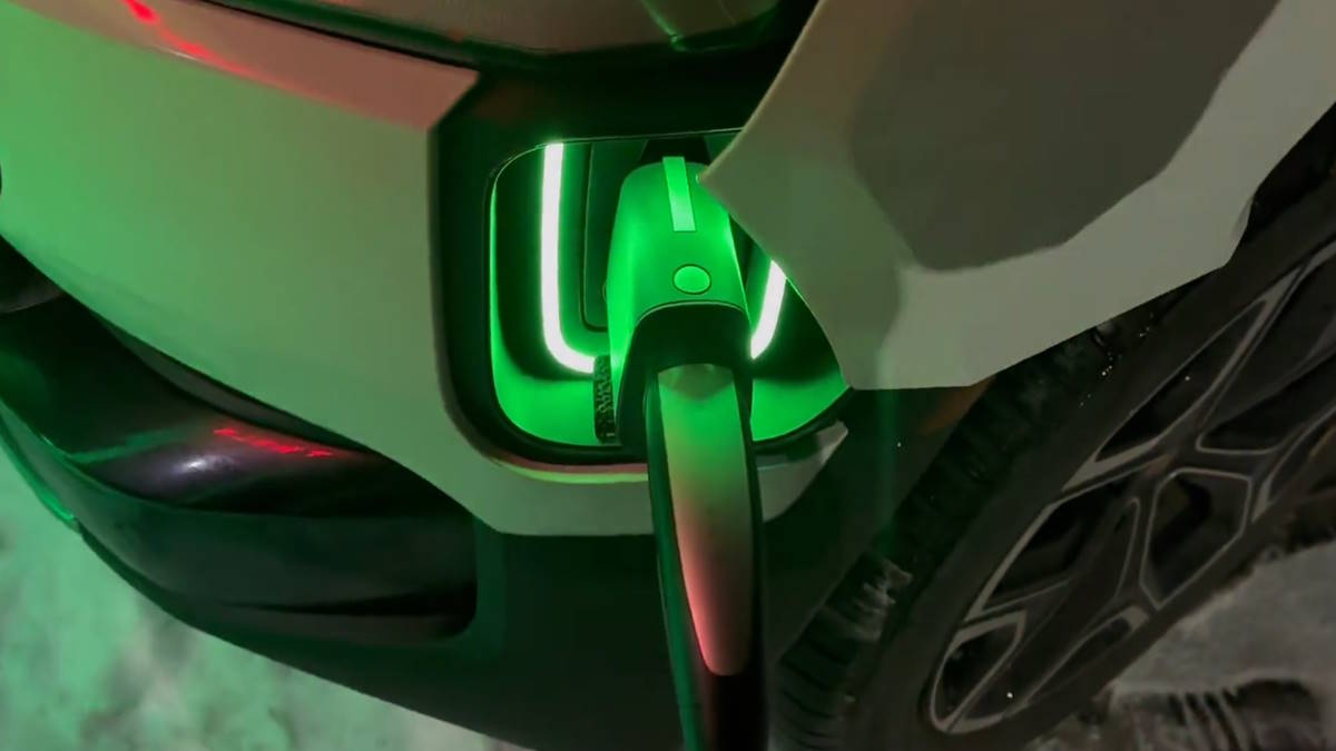 Magic Dock Engineering Genius In Action - Rivian and Ford Charge at Tesla  Supercharger