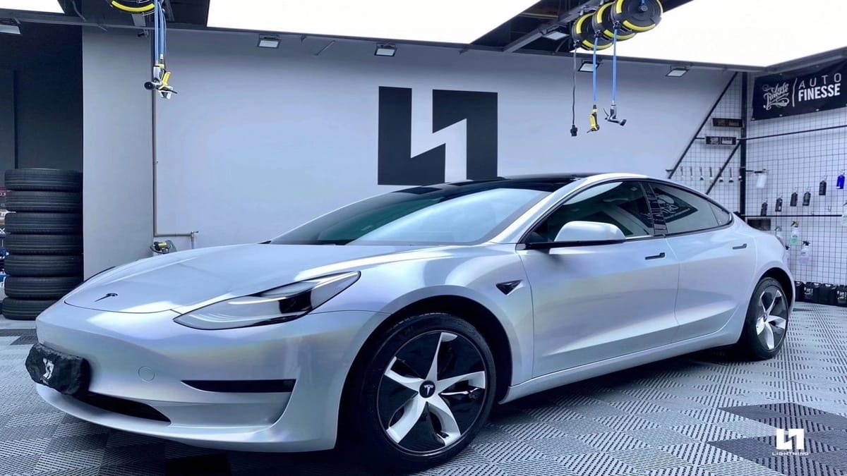 Here Comes Tesla Model 3 White Wrap Radiating Rainbow Hue | Torque News