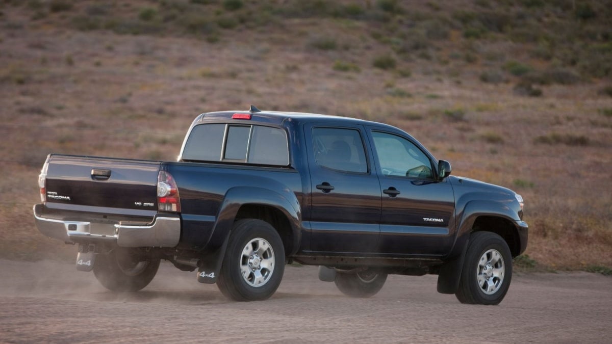 2012-2015 Toyota Tacoma driving off-road rear 3/4 view