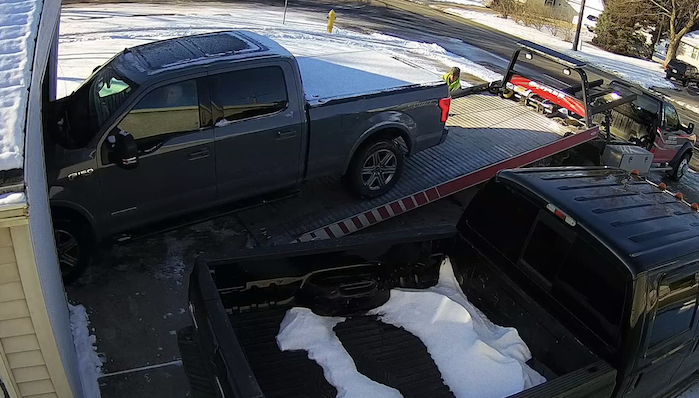 2019 Ford F-150 being loaded onto the tow truck