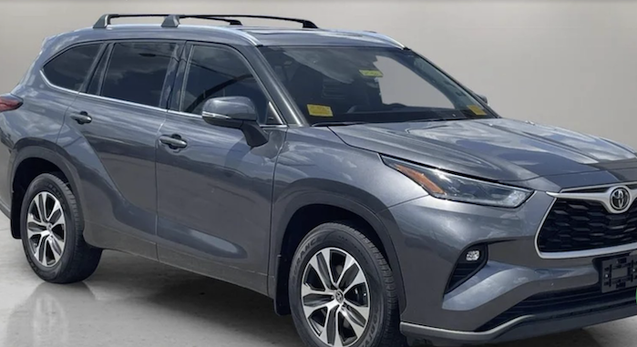 Jeff's 2021 Toyota Highlander at the dealer showroom