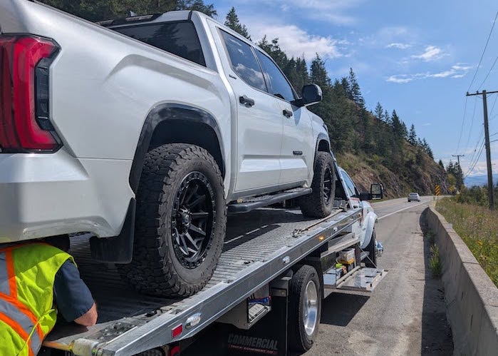 Tamas Balint's 2022 Toyota Tundra is being loaded on the tow truck