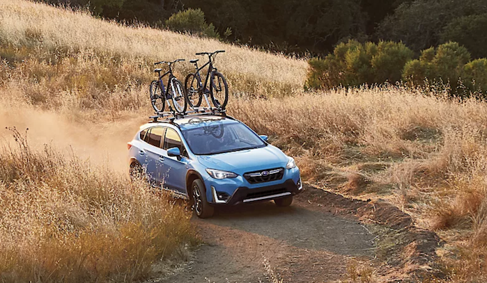 2023 Subaru Crosstrek Hybrid driving on a trail