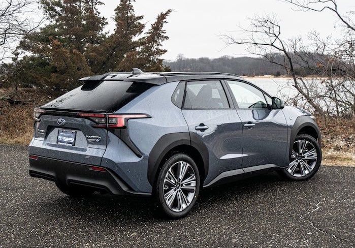 2023 Subaru Solterra sitting near a lake