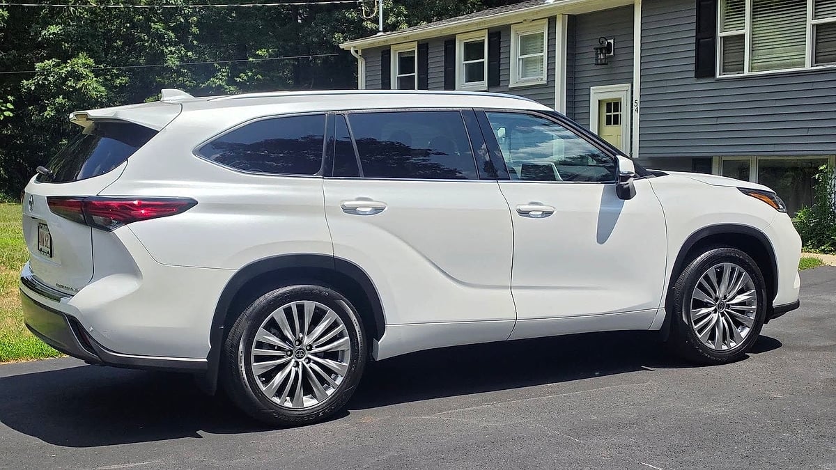 2023 Toyota Highlander Platinum parked in a Boston, Massachusetts driveway rear view