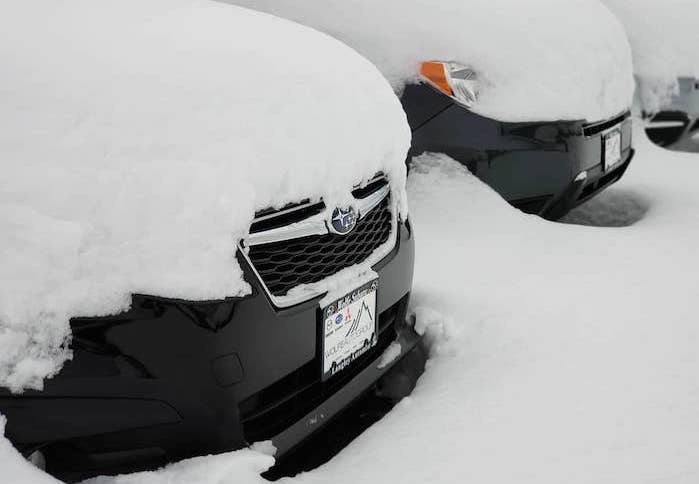 2024 Subaru Crosstrek covered in deep snow