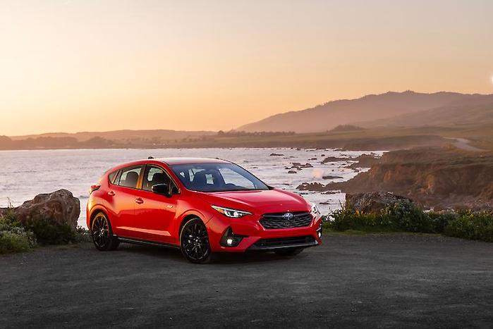 2024 Subaru Impreza sitting with a beach top view
