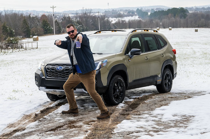 A happy Subaru dealer with a Forester 