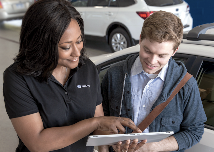 Subaru service rep with a customer
