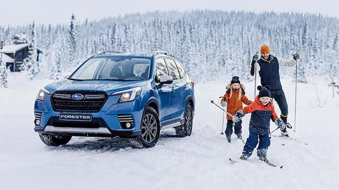 2024 Subaru Forester with a family skiing