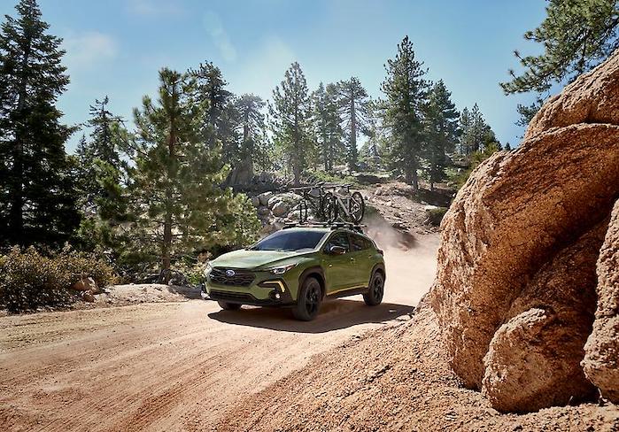 2024 Subaru Crosstrek driving on a dirt trail