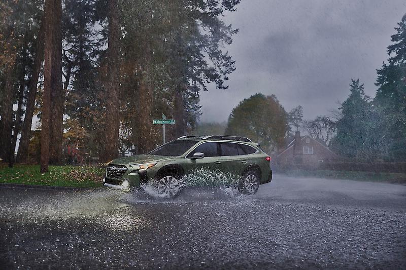 2024 Subaru Outback driving in the rain