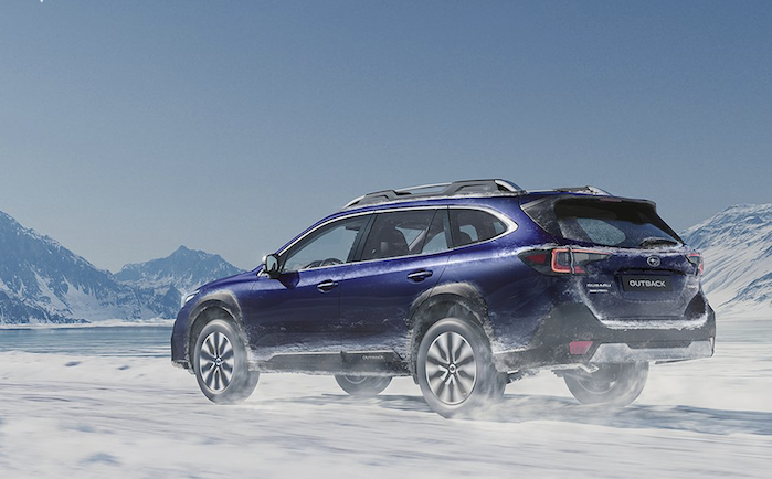 2024 Subaru Outback driving in the snow