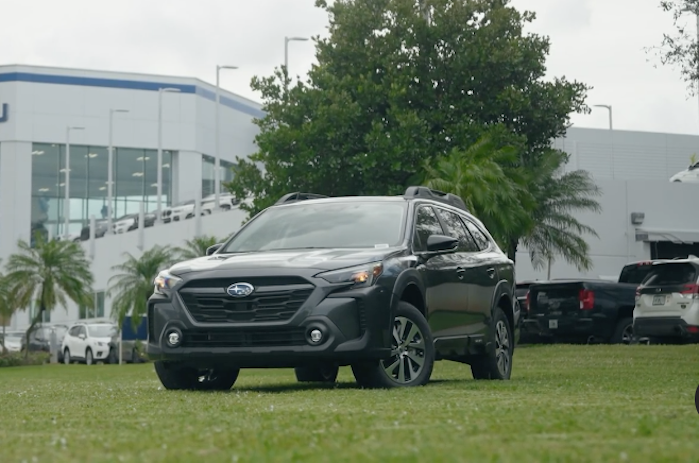 2024 Subaru Outback in front of showroom