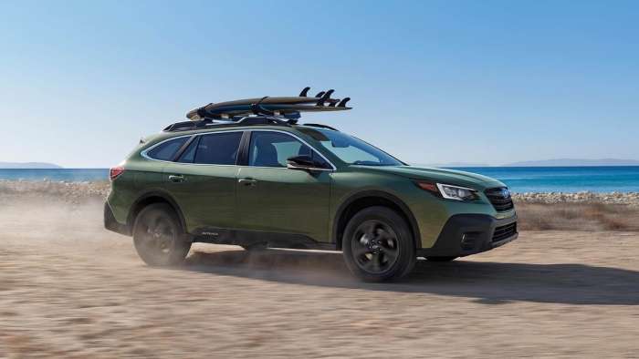 2024 Subaru Outback driving on the beach