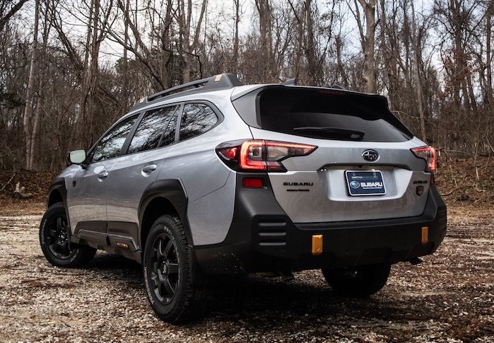 2024 Subaru Outback rear view in the woods