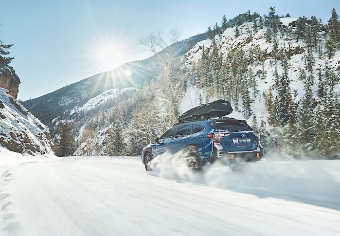 2024 Subaru Outback owner driving in the snow