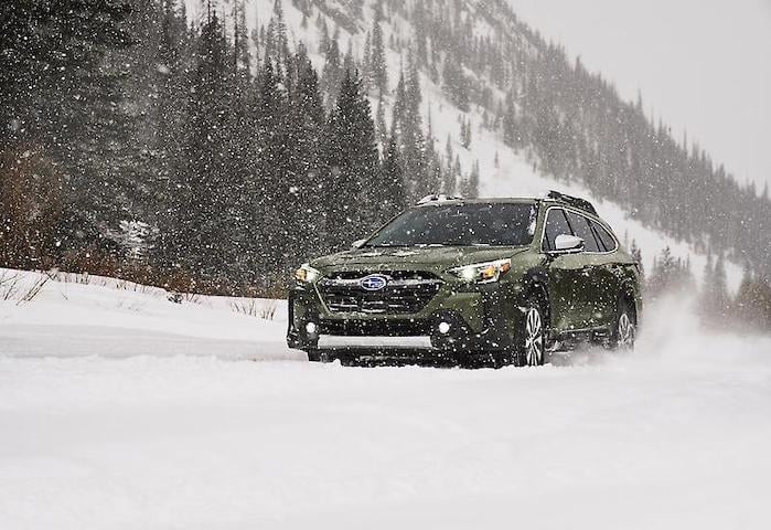 2024 Subaru Outback on a snowy mountain pass