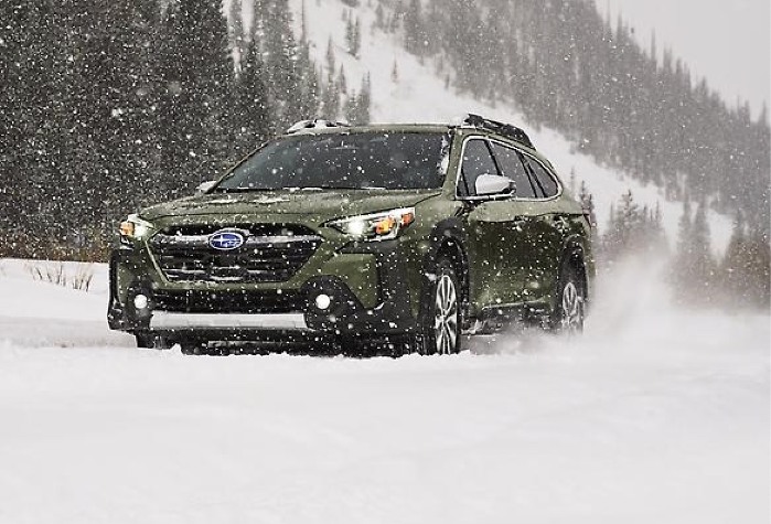 2024 Subaru Outback driving in a snowstorm
