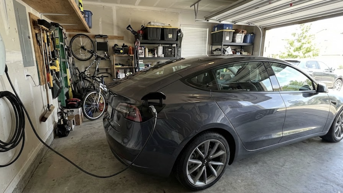 2024 Tesla Model 3 charging in the garage