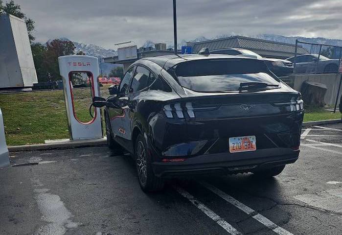 Mustang Mach-E at Tesla Supercharger taking up two spots